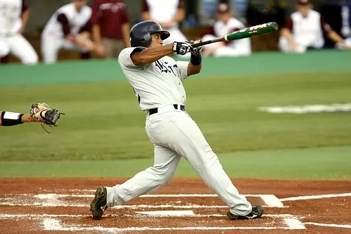 A baseball player swinging at the ball during a game.